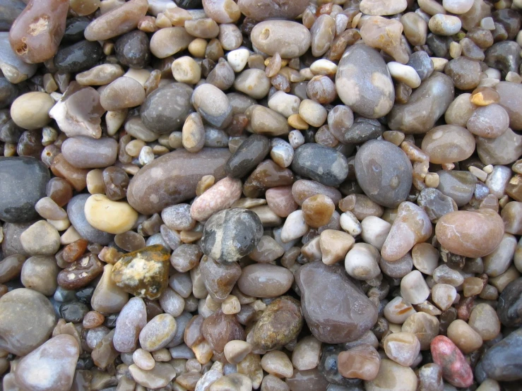 close up image of large rocks with gravel underneath