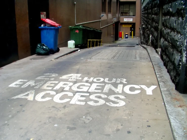 the entrance to an emergency access building with white painted on it