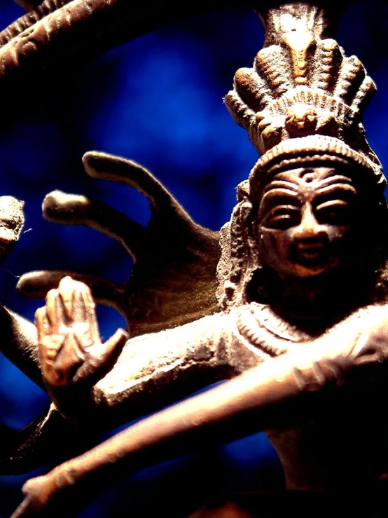 statues of an indian woman holding hands up
