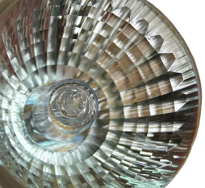 an art glass sink with an unusual shaped drain