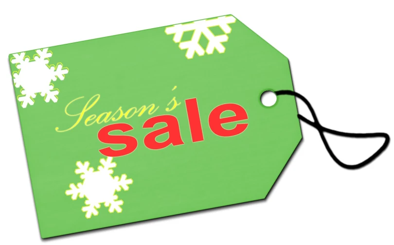 a green and red christmas sale tag with snowflakes