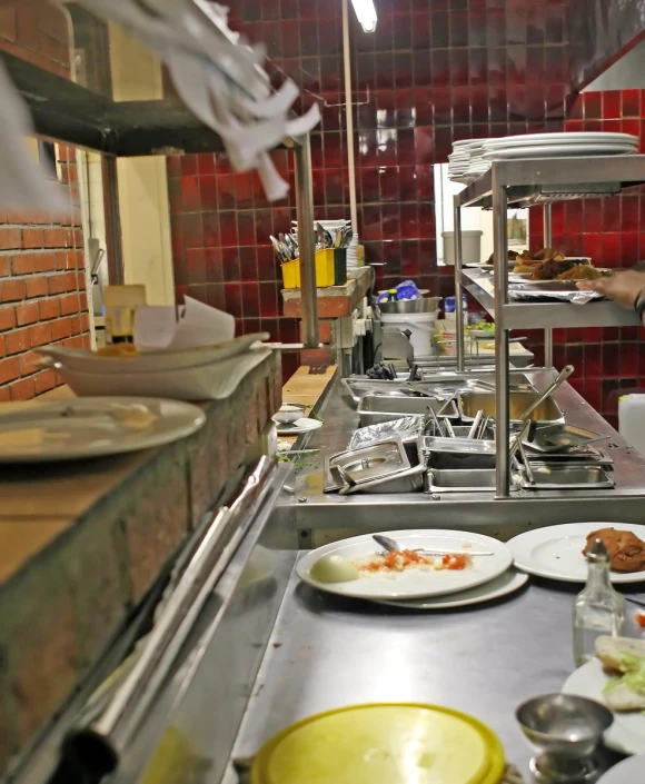 a kitchen with a bunch of plates on the counters