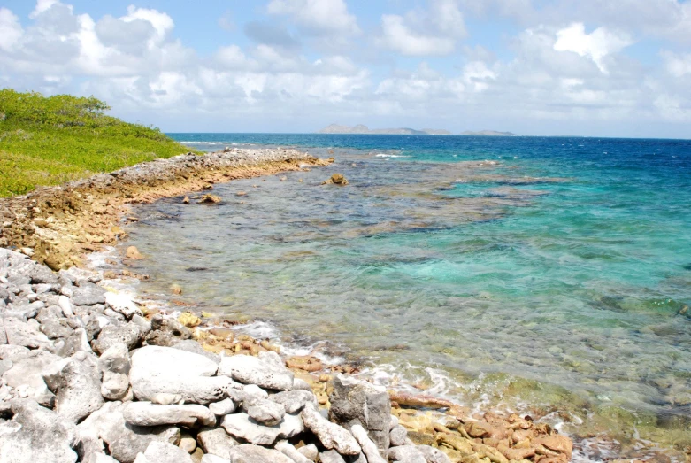 an island with many water and rocks near the shore