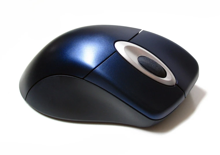 a computer mouse sitting on a white surface