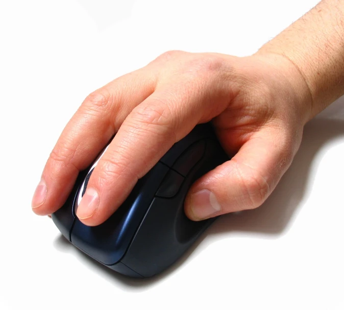 the hand of a person who is holding the mouse