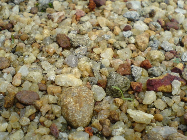 a pile of rocks with small gravel next to it