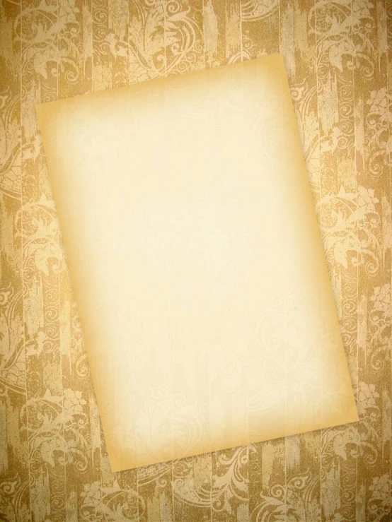 an empty piece of parchment paper on a paisley print background