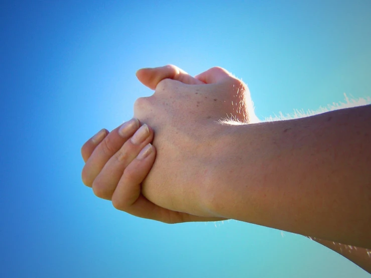 a man's hand on top of his arm and arm