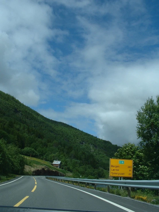 a scenic drive with a sign in the front