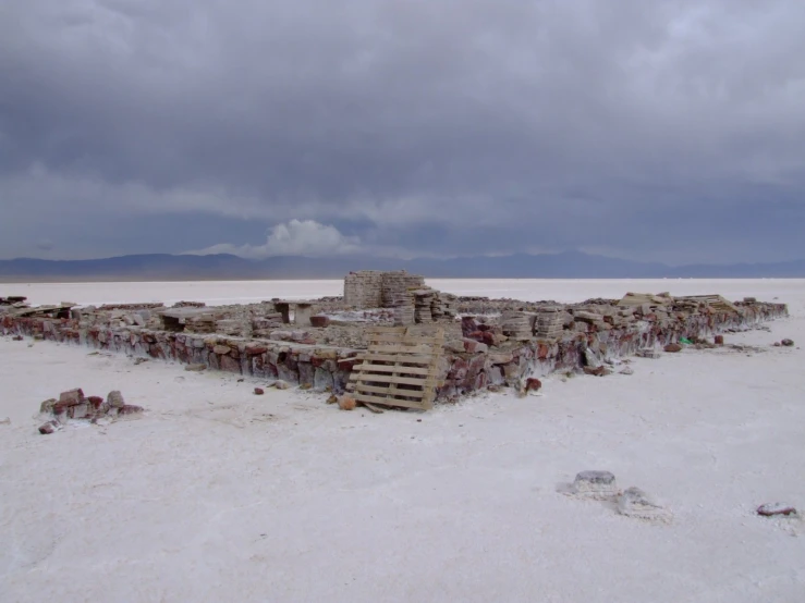 a pile of rubble sitting in the middle of a desert