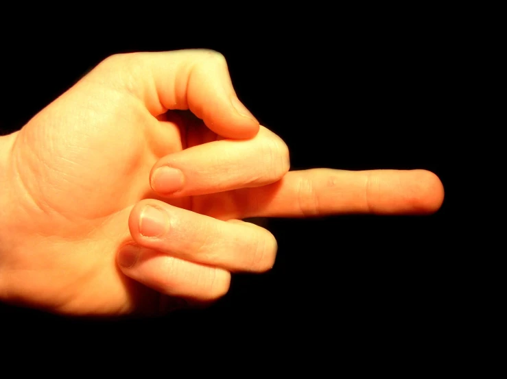 a person holding onto a finger and pointing it down