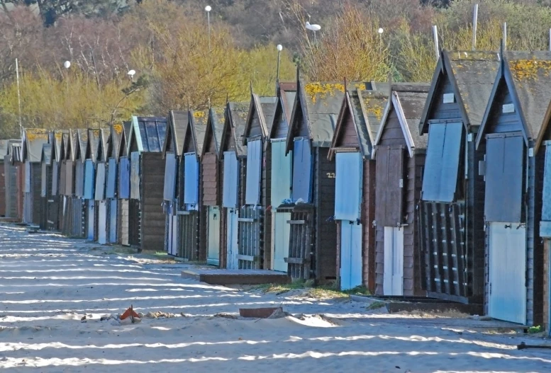 the large row of wooden houses are standing out from each other