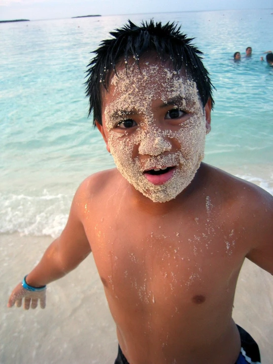 an up close po of a small child with food on his face