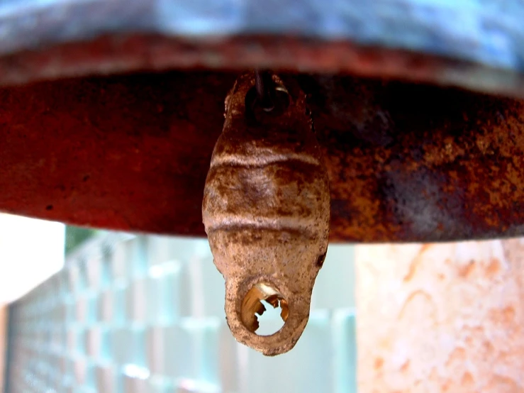 a close - up of a brown, worn down piece of art