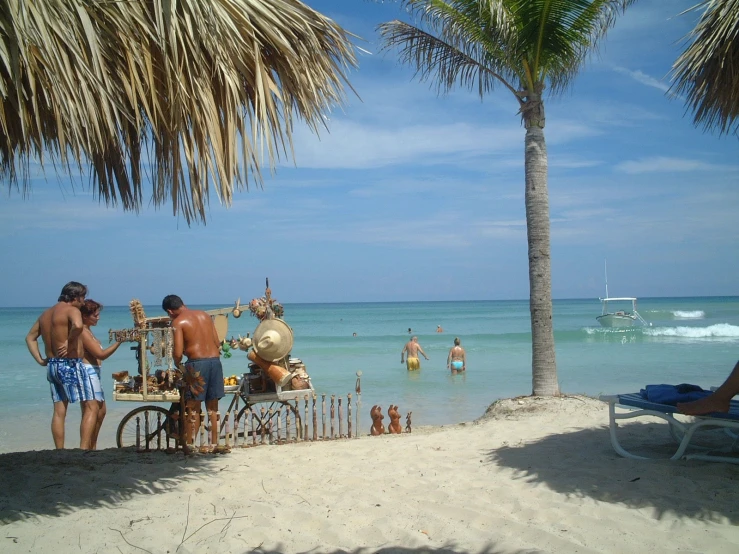 people enjoying a day at the beach with bikes