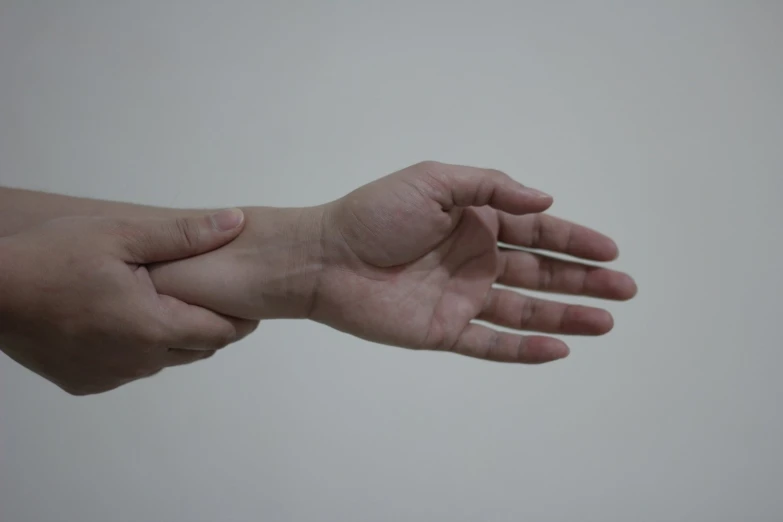 a person is holding soing in one hand
