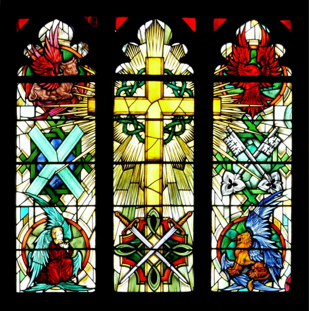 an artistic stained glass window depicting jesus and other symbols