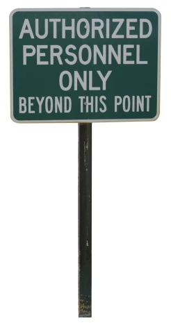 a sign stating that authorized person is only beyond this point