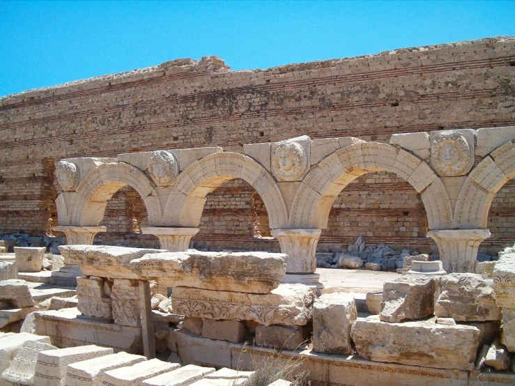 the old stone structure with arches and bricks