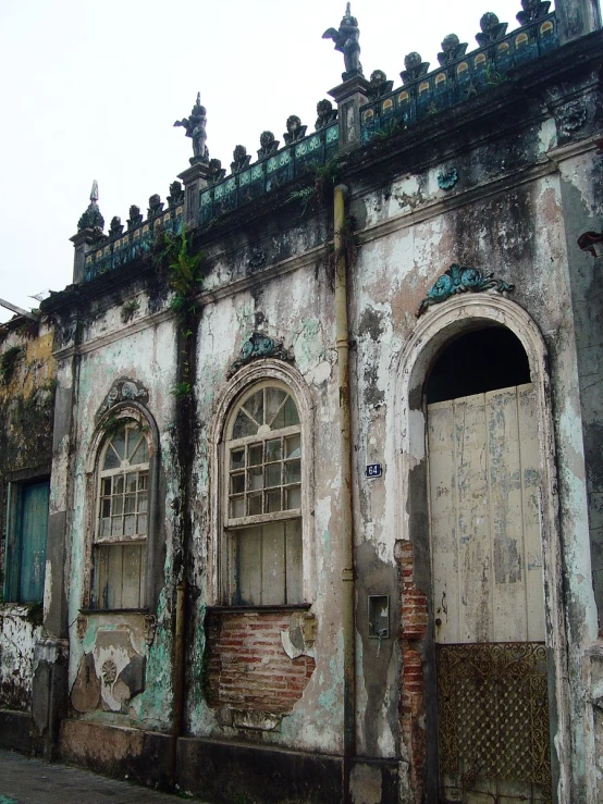 a brick building with an ornate top window