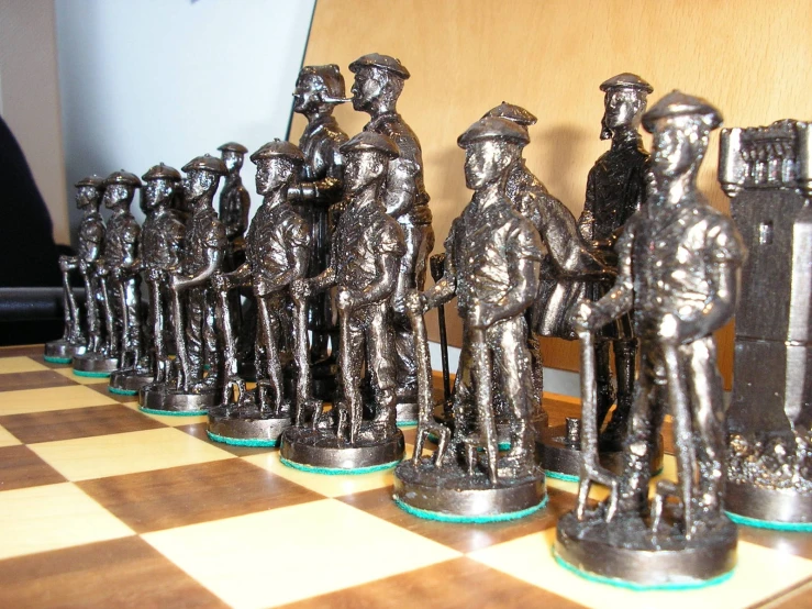 a row of toy army men on a chess board
