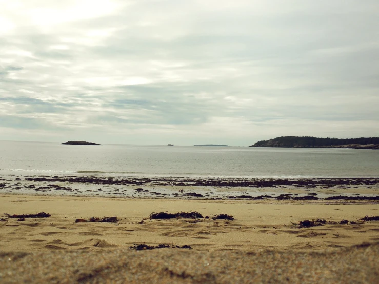 a very big open ocean with some sand and water