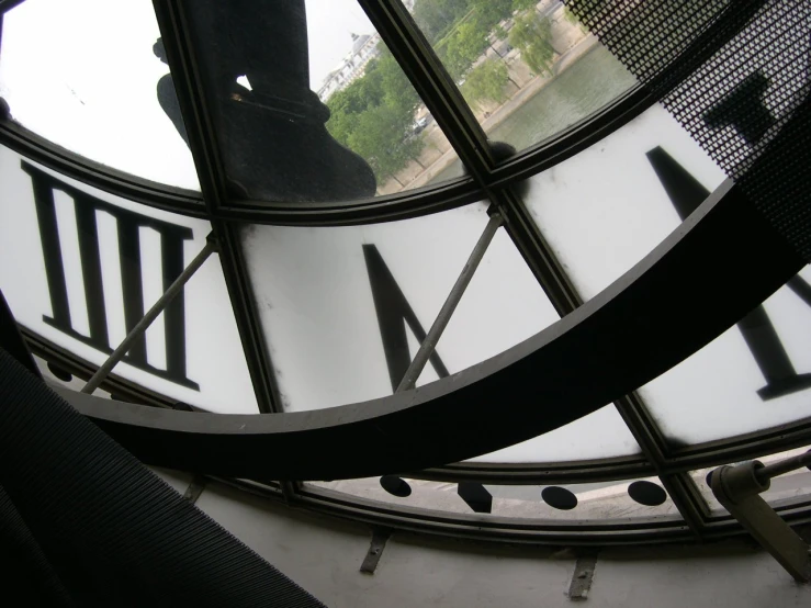 the inside of a clock showing the faces of people