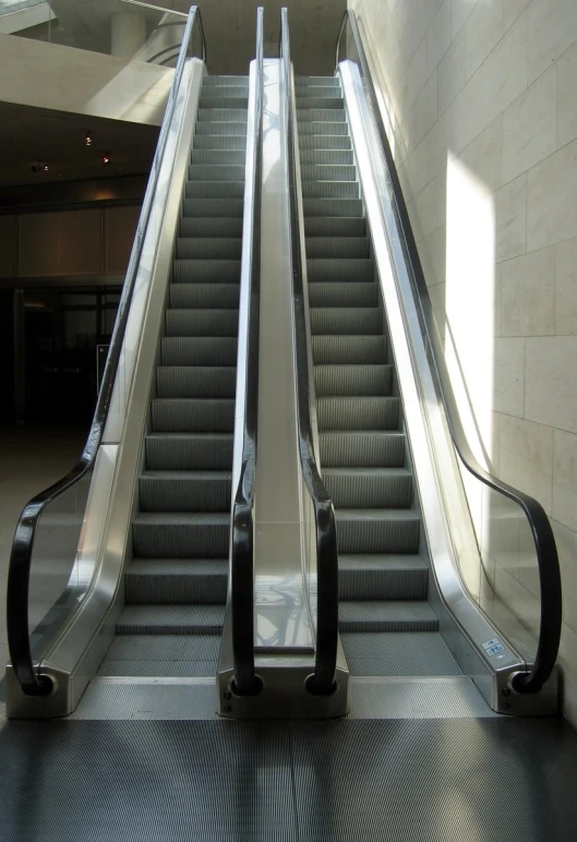 a man on an escalator with a backpack