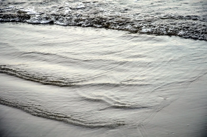 an image of a view of the sand and water