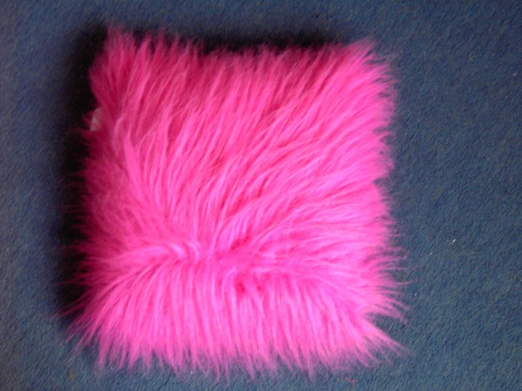 a cellphone case with some bright pink fur
