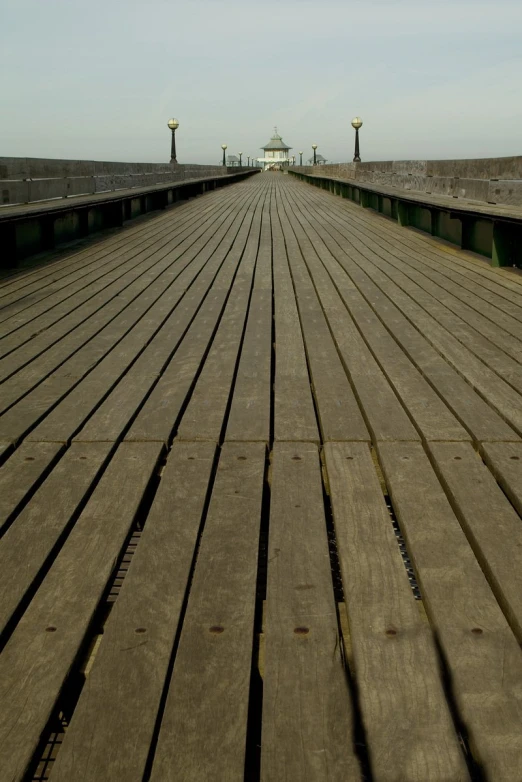 long boardwalk at the edge of a big body of water