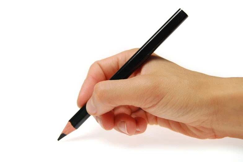 a person holding a pencil in one hand and a marker in the other