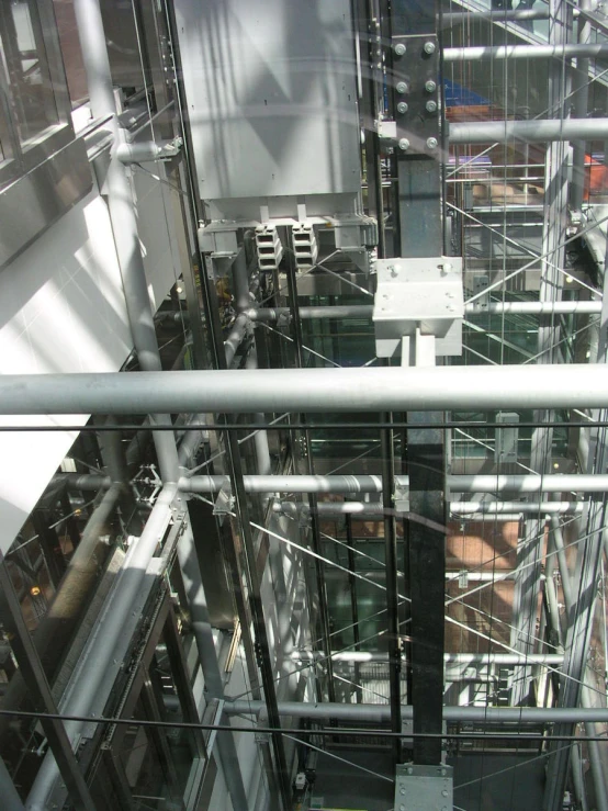 a very high up view of some buildings and metal bars