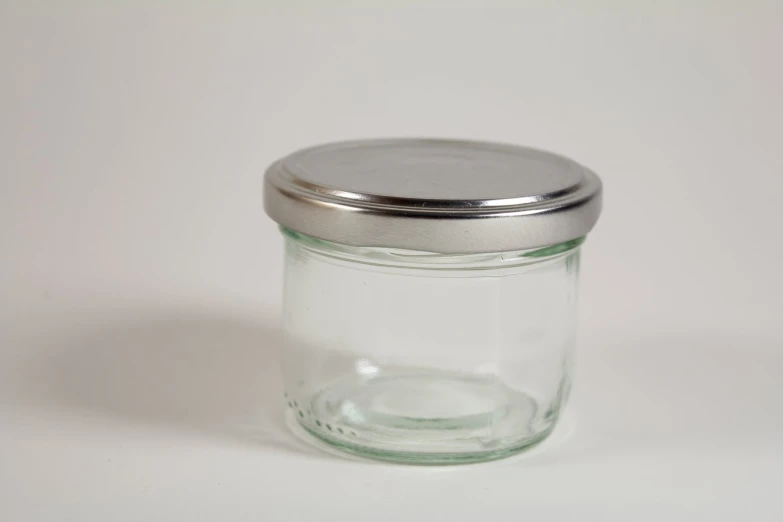 a jar with a lid sitting on the table