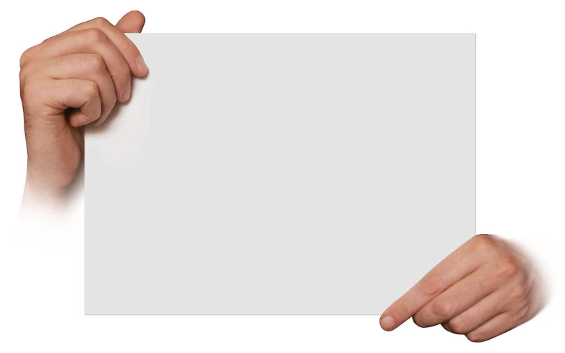 two hands holding a piece of paper