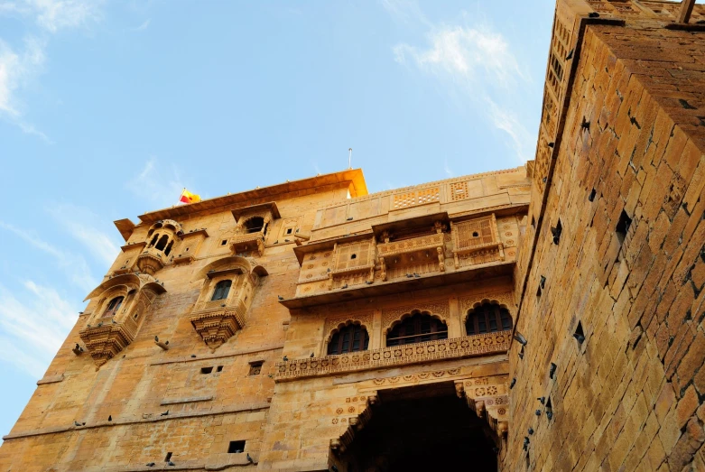 an old brick building with ornate carved architecture