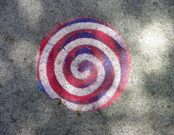 a colorful, circular design on the ground