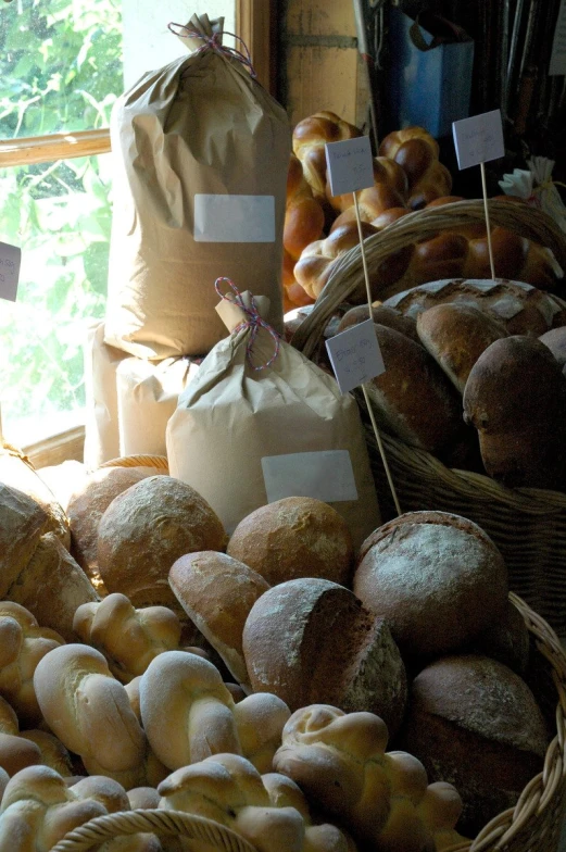 there are baskets and bagels that are on display