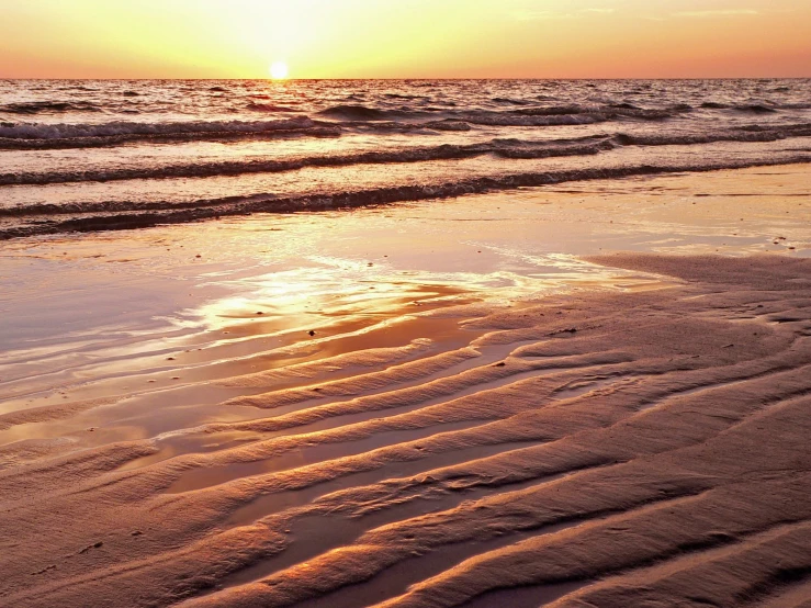 sand with a line in it that looks like stripes in the ground