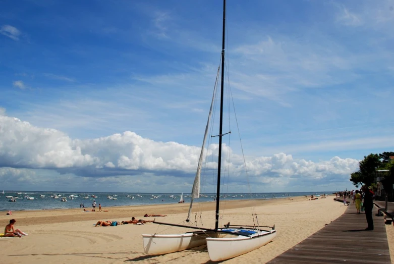 boats on the beach are tied to a dock