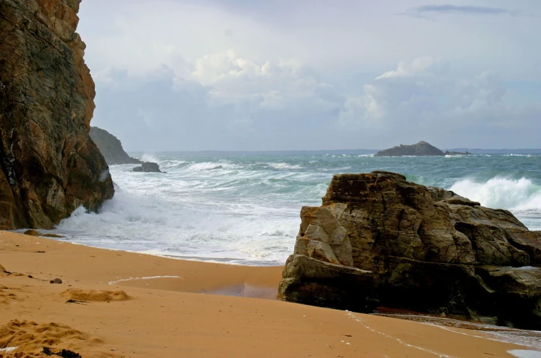 a body of water near a rocky coastline