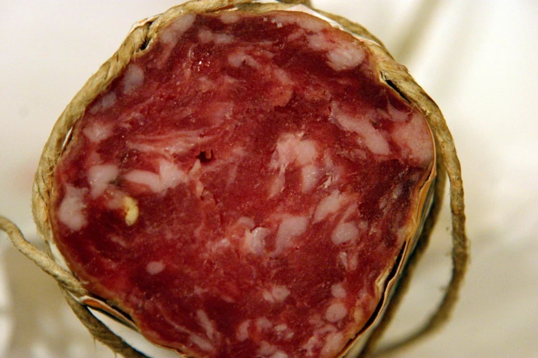 closeup of a slice of salami displayed in basket