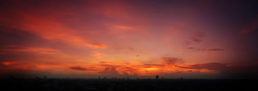 a sunset view looking east over city skyline