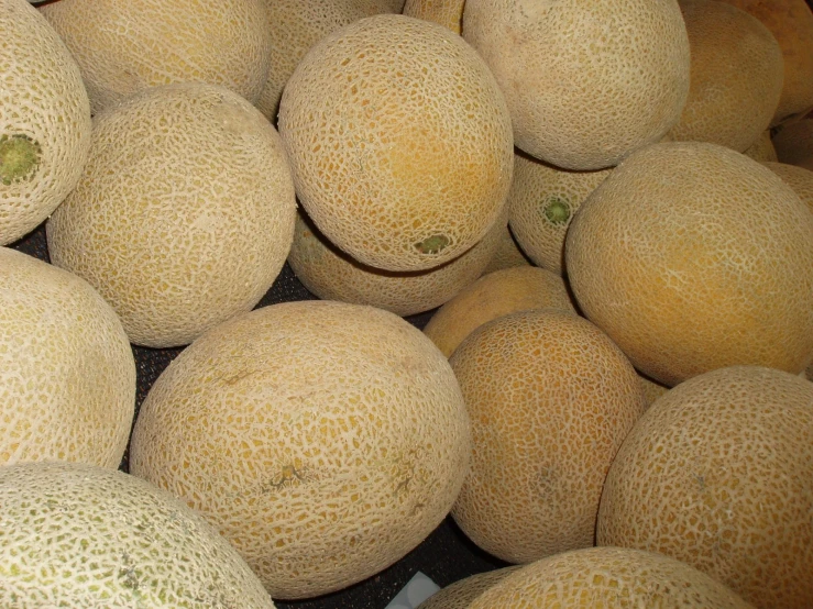 melons are piled up and ready to be sold