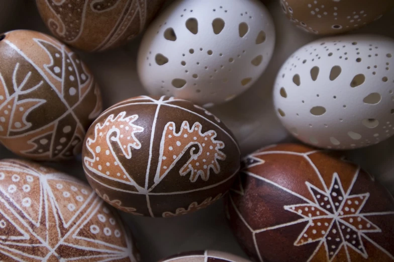 several eggs in decorated brown and white designs