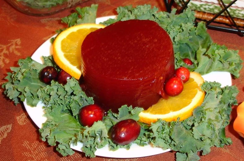 a plate with a cake and fruit on it