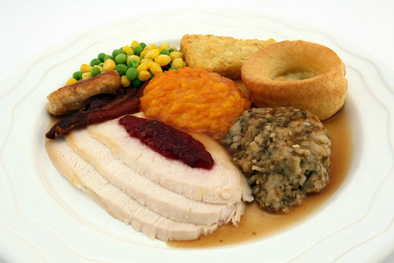 an assortment of food is arranged on a white plate