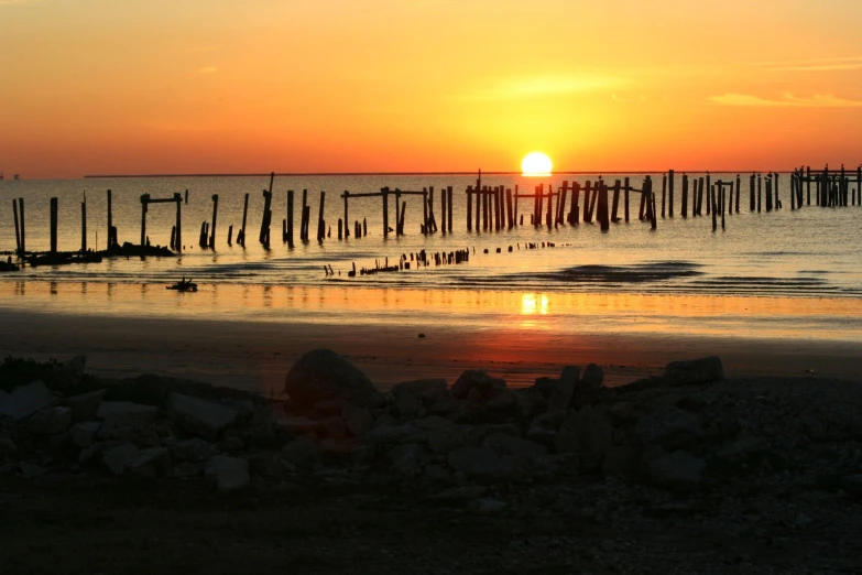 a sunset that is reflecting on the water