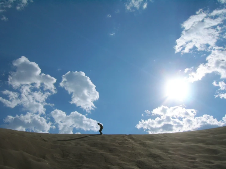 a man standing on top of a hill