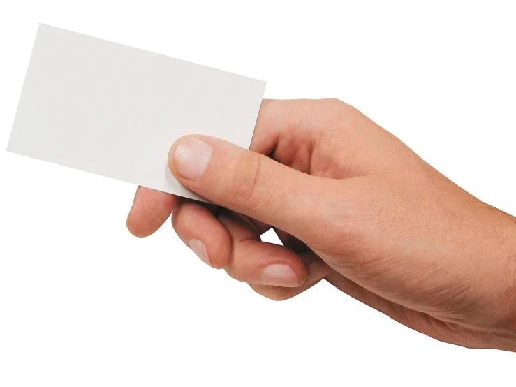 a man's hand holding a business card